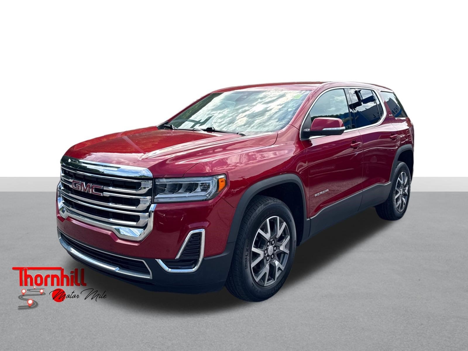 2023 GMC Acadia SLE in Volcanic Red Tintcoat — front three-quarter view