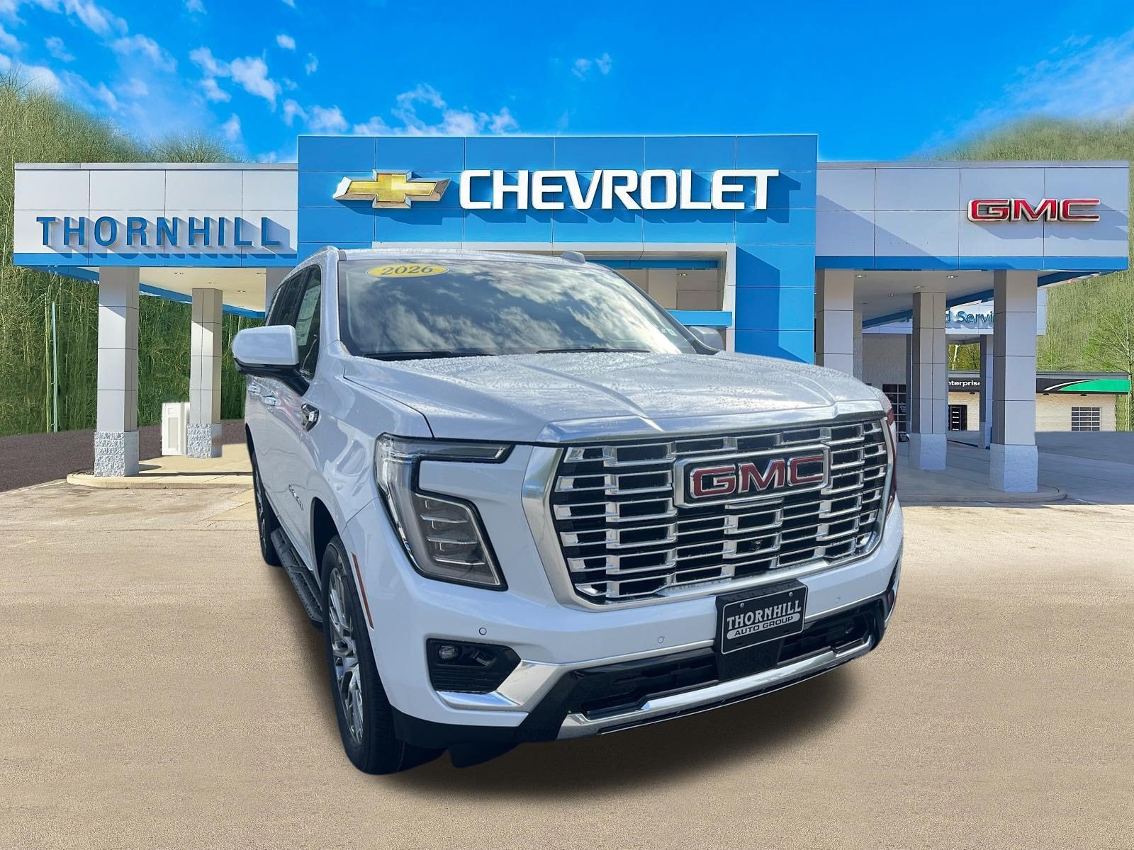 2026 GMC Yukon Denali in Glacier White Tricoat — front three-quarter view