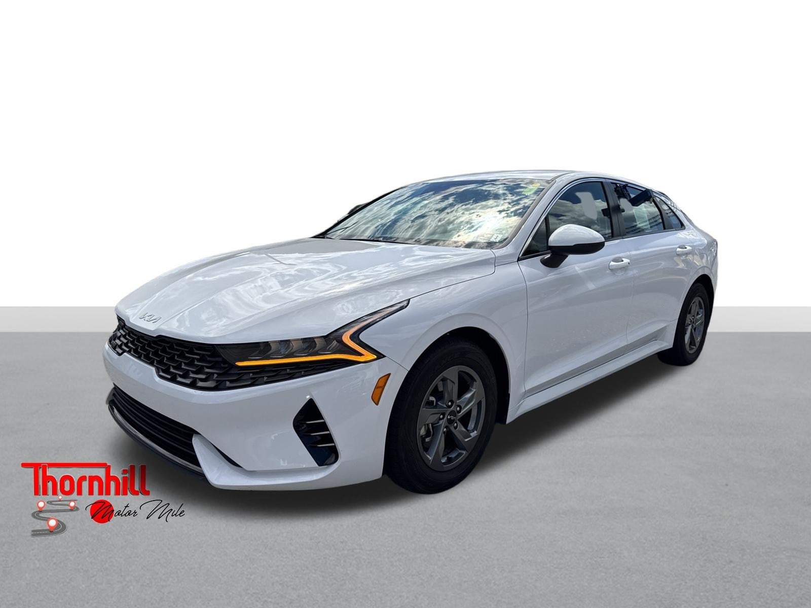 2024 Kia K5 LXS in Glacial White — front three-quarter view
